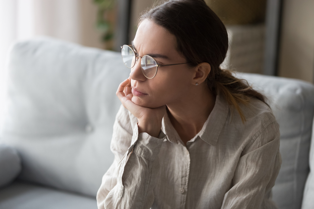 Woman sitting alone feeling sad